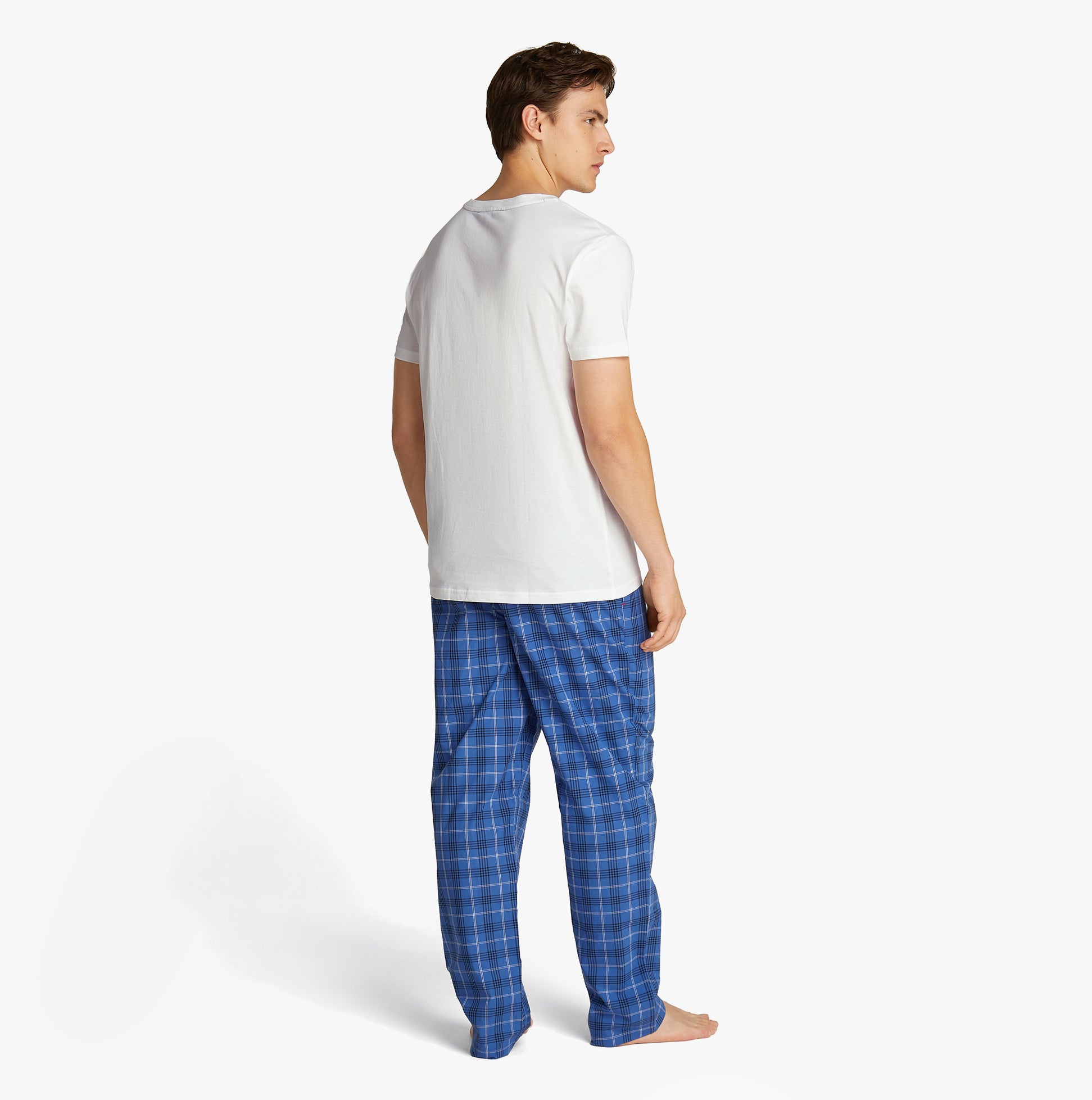 Tommy Hilfiger COLOUR BLOCKED Mens T-Shirt Optic White back view with blue plaid pajama pants.