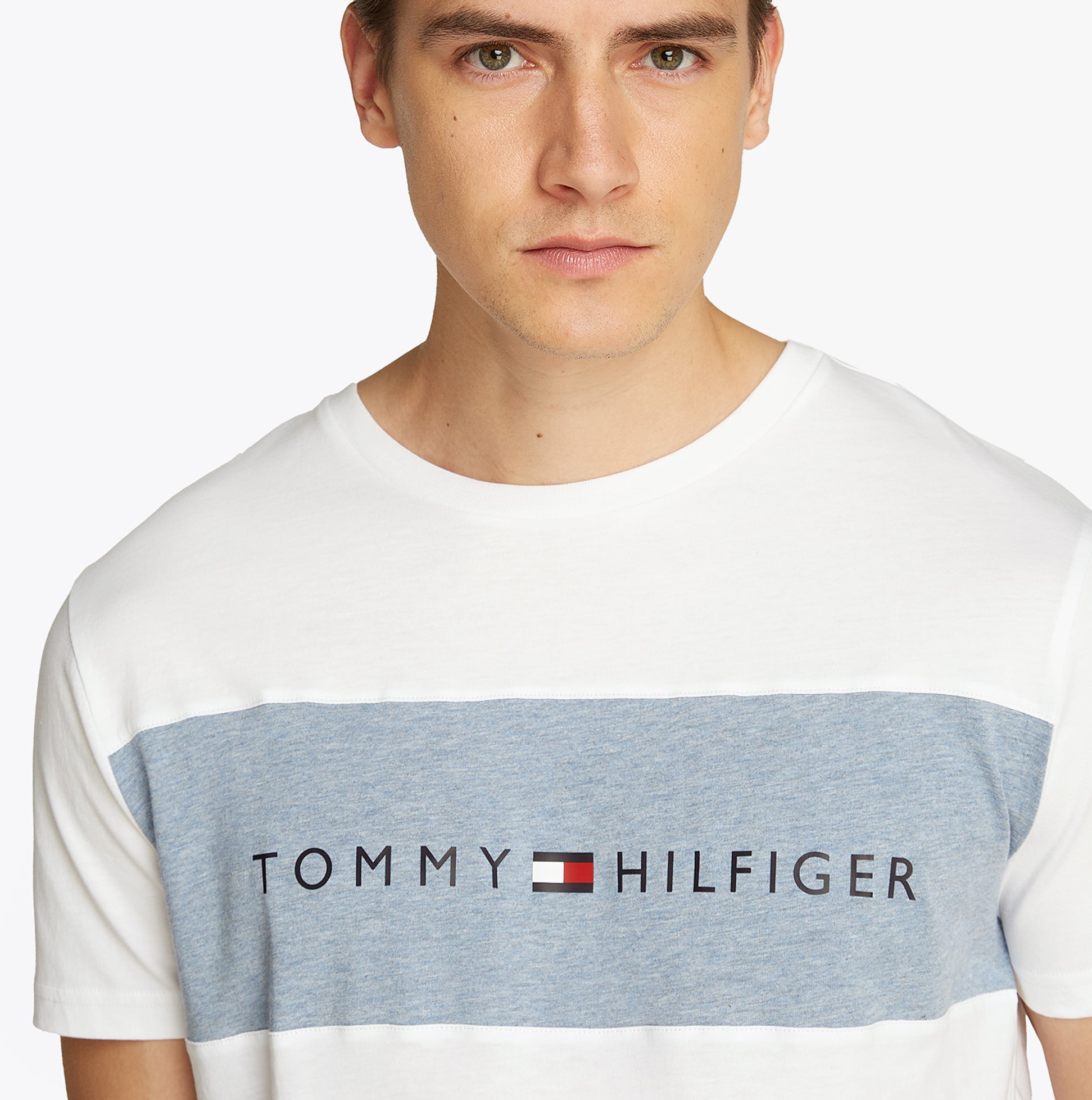 Tommy Hilfiger COLOUR BLOCKED Mens T-Shirt Optic White front view featuring blue panel and TH logo.