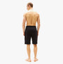 Tommy Hilfiger Mens Lounge Shorts Black back view on model, showcasing regular fit and black color.