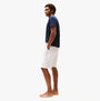 Tommy Hilfiger Mens Lounge Shorts Beige side view worn by model, featuring elastic waistband and relaxed fit.