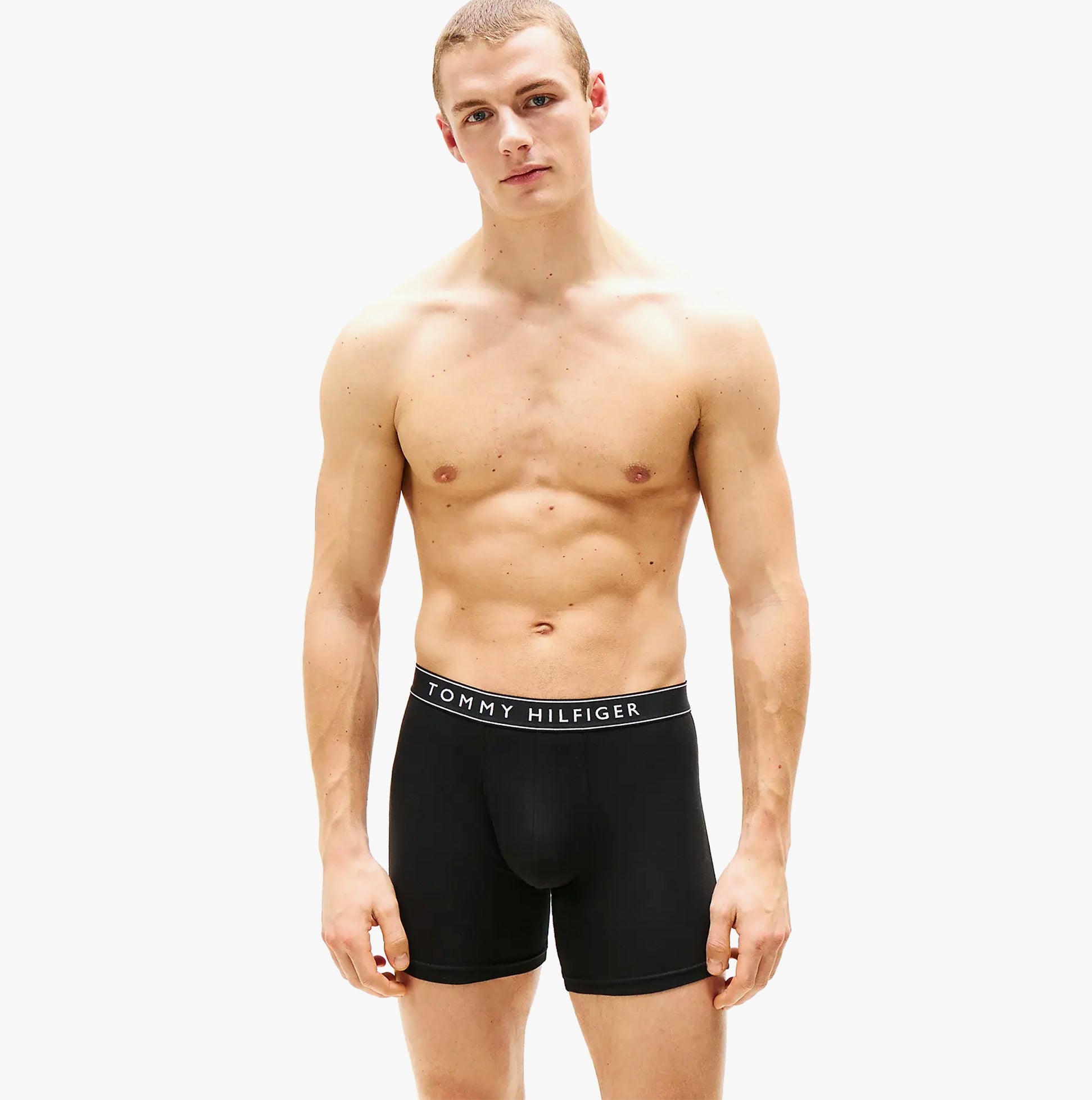 Tommy Hilfiger Mens 3 Pack Waistband Boxer Brief Black front view model wearing boxer briefs