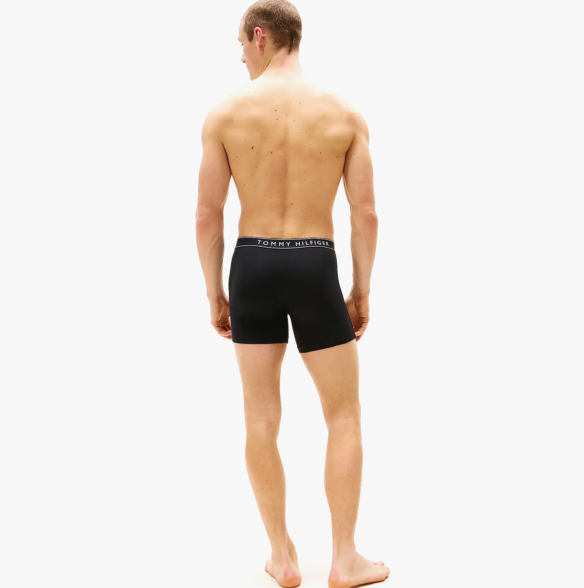 Tommy Hilfiger Mens 3 Pack Waistband Boxer Brief Black, back view on model showing waistband detail.