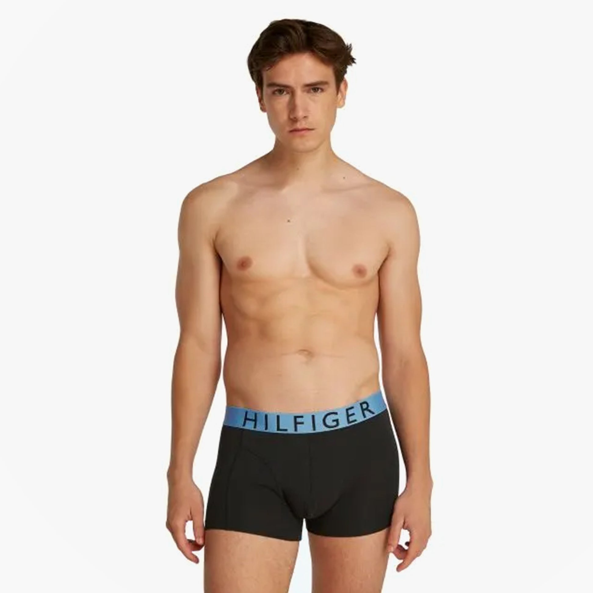 Tommy Hilfiger TRUNK 3 Pack Mens Trunk Multicoloured front view model wearing trunk with blue logo waistband.
