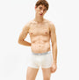 Tommy Hilfiger 3 Pack Mens Trunks Des Sky/Calico/Fssl Blue front view on model, featuring stretch cotton and TH logo waistband.