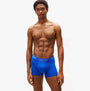 Tommy Hilfiger Mens 3 Pack Logo Waistband Cotton Trunks Multi front view in blue color with logo waistband, model displaying fit.