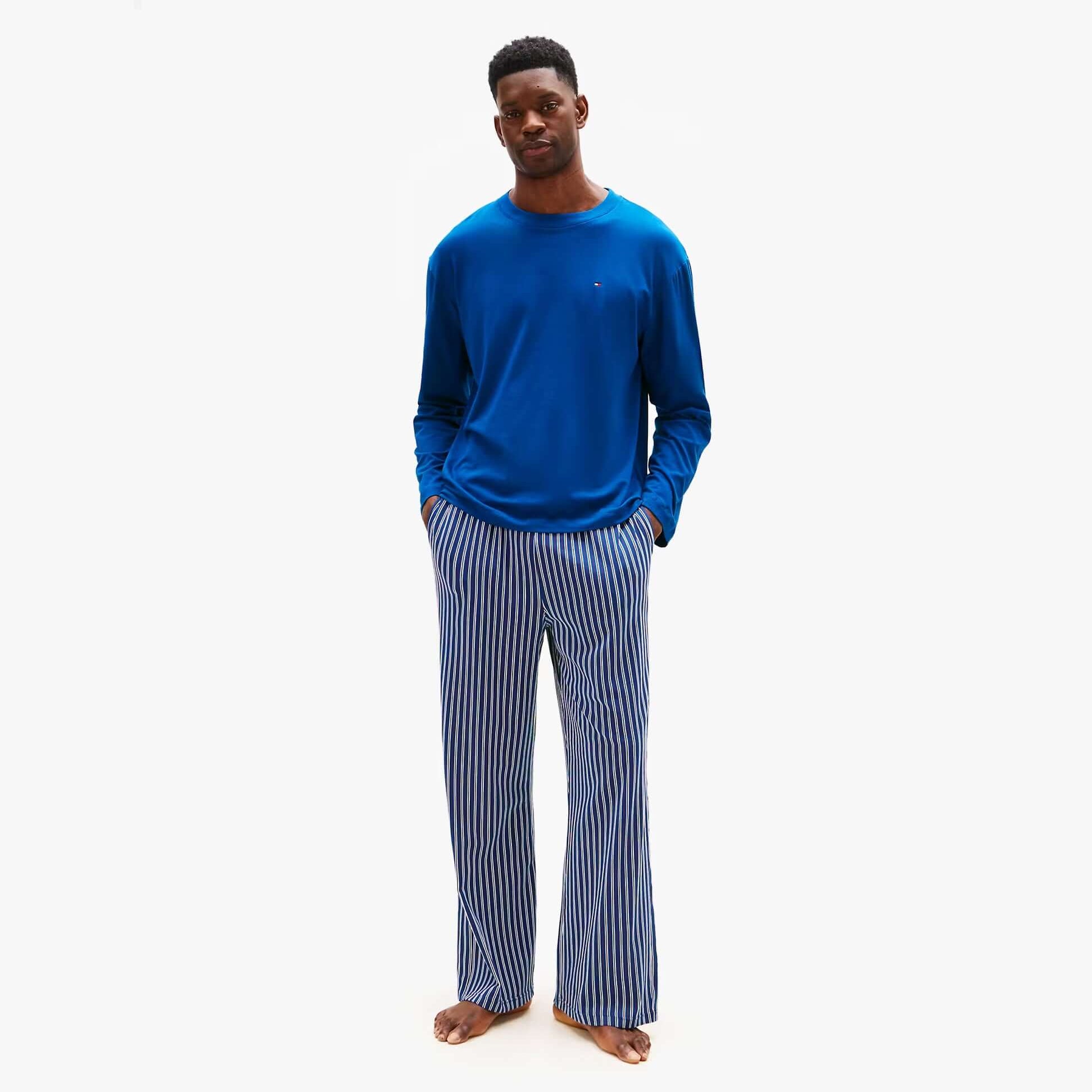 Tommy Hilfiger JERSEY PJ SET Mens Set Multicoloured front view model wearing blue top and striped pants.