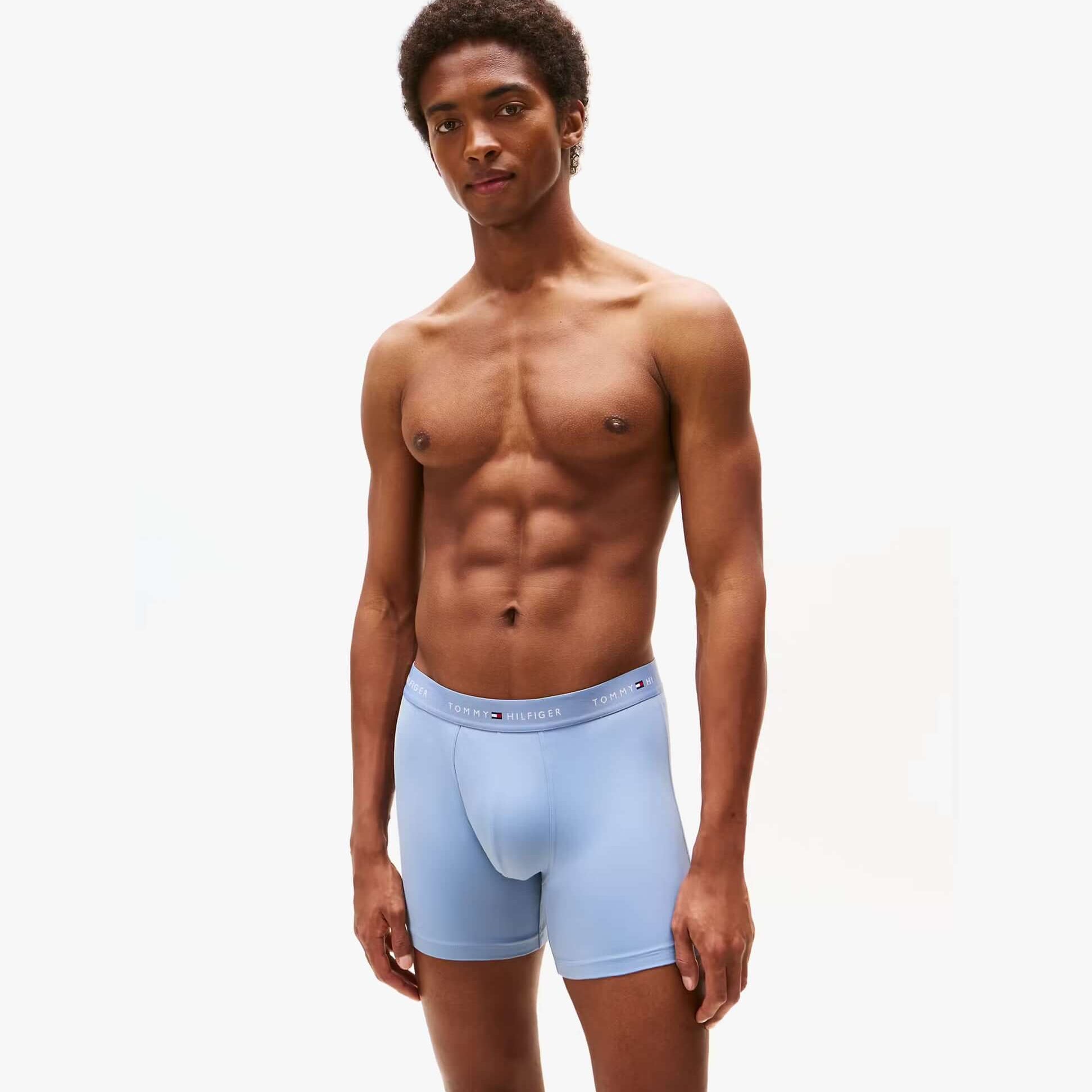 Tommy Hilfiger Mens Signature Microfibre 3 Pack Boxer Briefs Blue Multi front view on model, showcasing soft material and comfortable fit.
