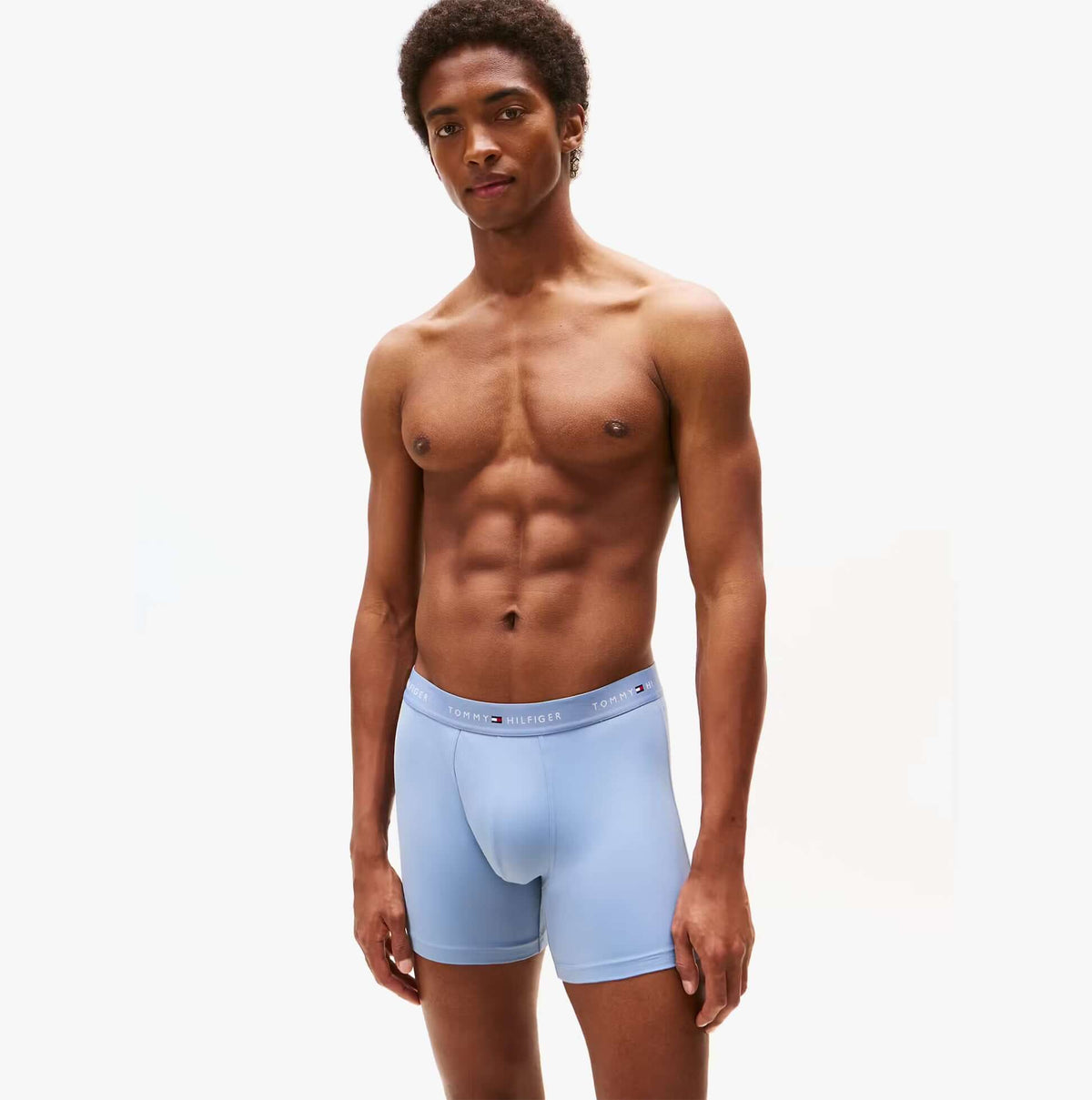 Tommy Hilfiger Mens Signature Microfibre 3 Pack Boxer Briefs Blue Multi front view on model, showcasing soft material and comfortable fit.