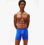 Tommy Hilfiger Mens Signature Microfibre 3 Pack Boxer Briefs Blue Multi front view on model, showcasing comfort and fit.