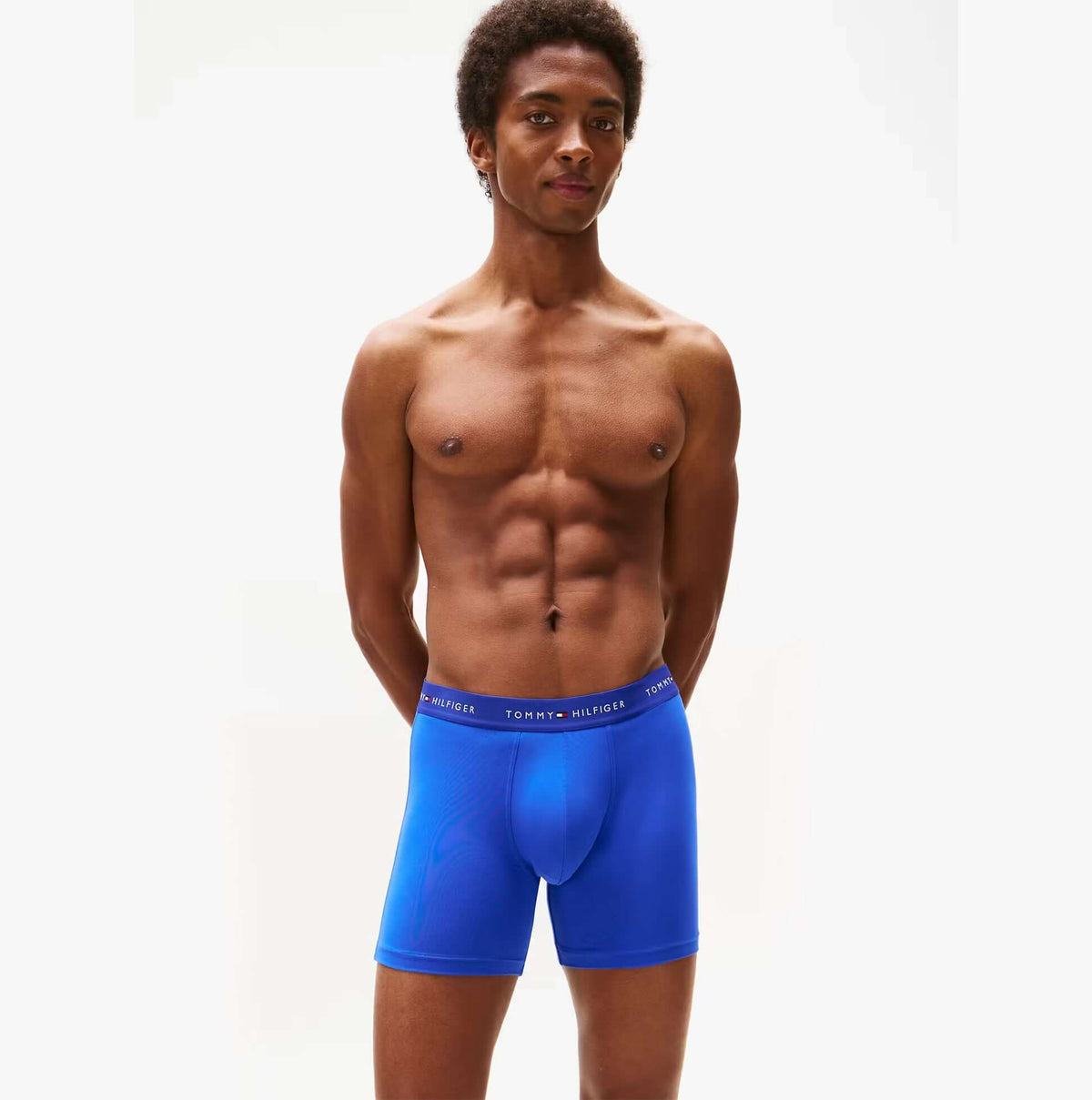 Tommy Hilfiger Mens Signature Microfibre 3 Pack Boxer Briefs Blue Multi front view on model, showcasing comfort and fit.