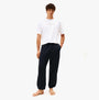 Tommy Hilfiger TRACK PANT Mens Desert Sky front view, model wearing regular fit pants, 60% regenerative cotton, 40% sustainable modal.