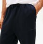 Tommy Hilfiger TRACK PANT Mens Desert Sky detail view with logo and pockets, showcasing fabric and color.