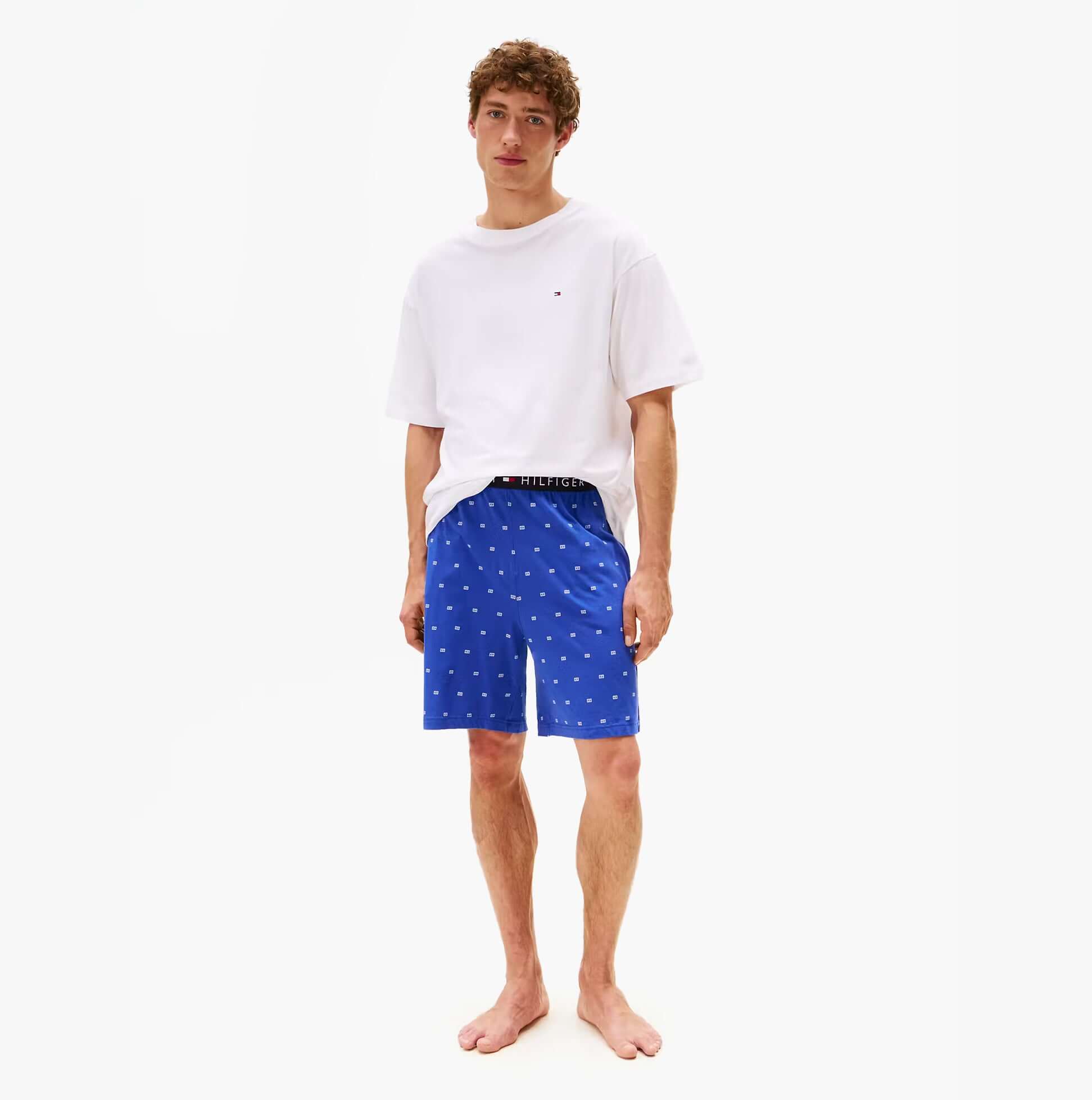 Tommy Hilfiger SS JERSEY PJ SET Mens Pyjama Set Multicoloured, front view of model wearing blue shorts and white t-shirt.