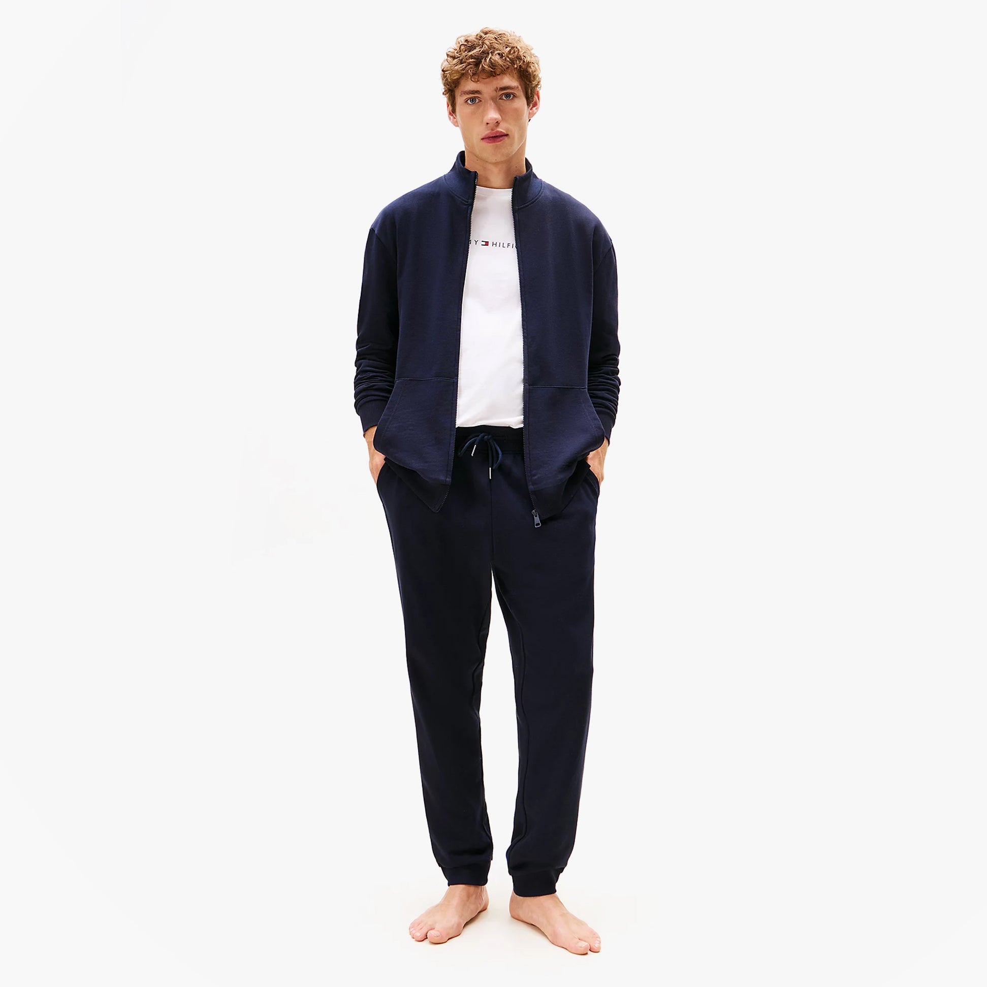 Tommy Hilfiger TH Original Mens Logo Lounge Joggers Desert Sky front view on model wearing a zip-up jacket and t-shirt.