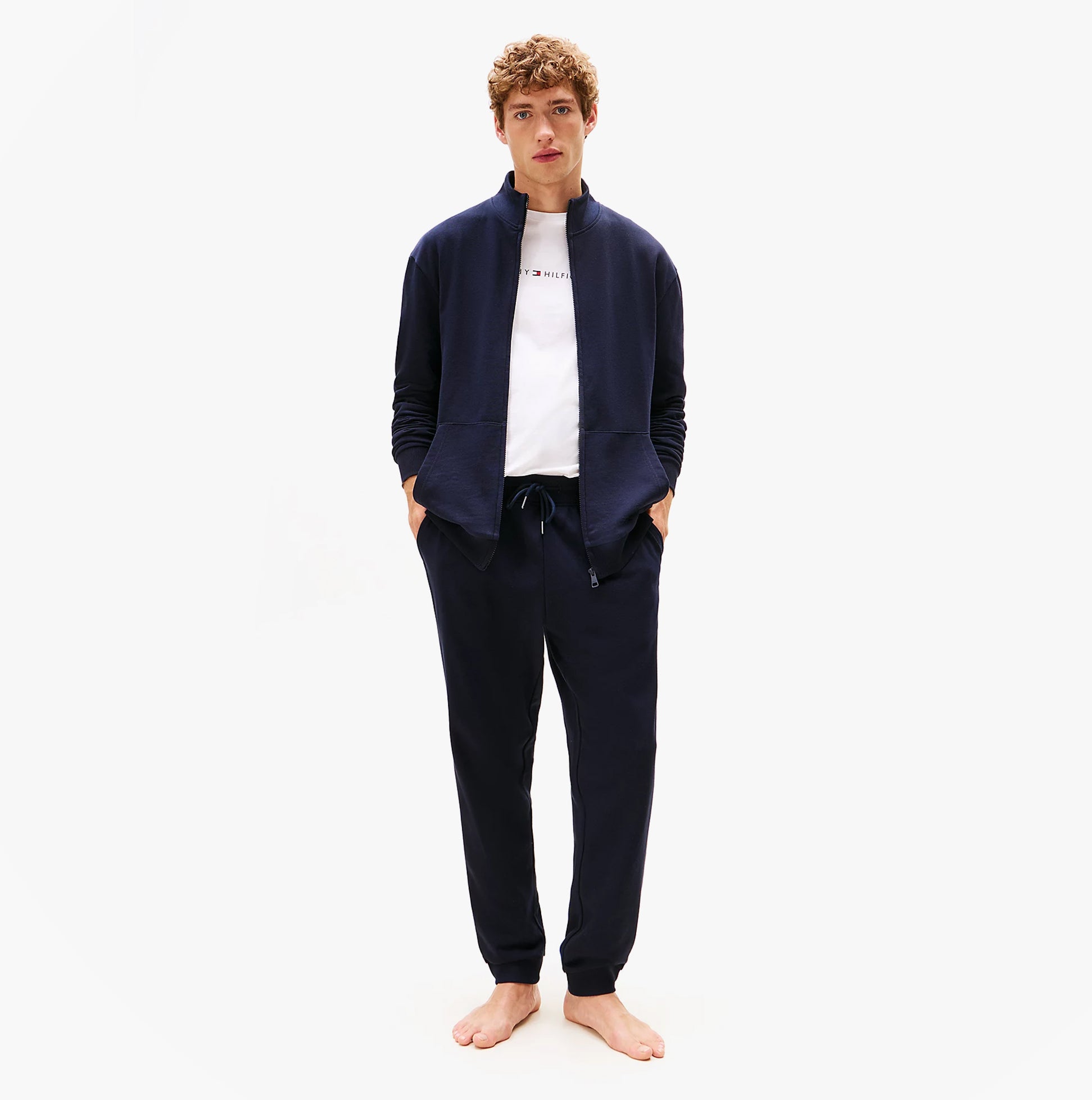 Tommy Hilfiger TH Original Mens Logo Lounge Joggers Desert Sky front view on model wearing a zip-up jacket and t-shirt.