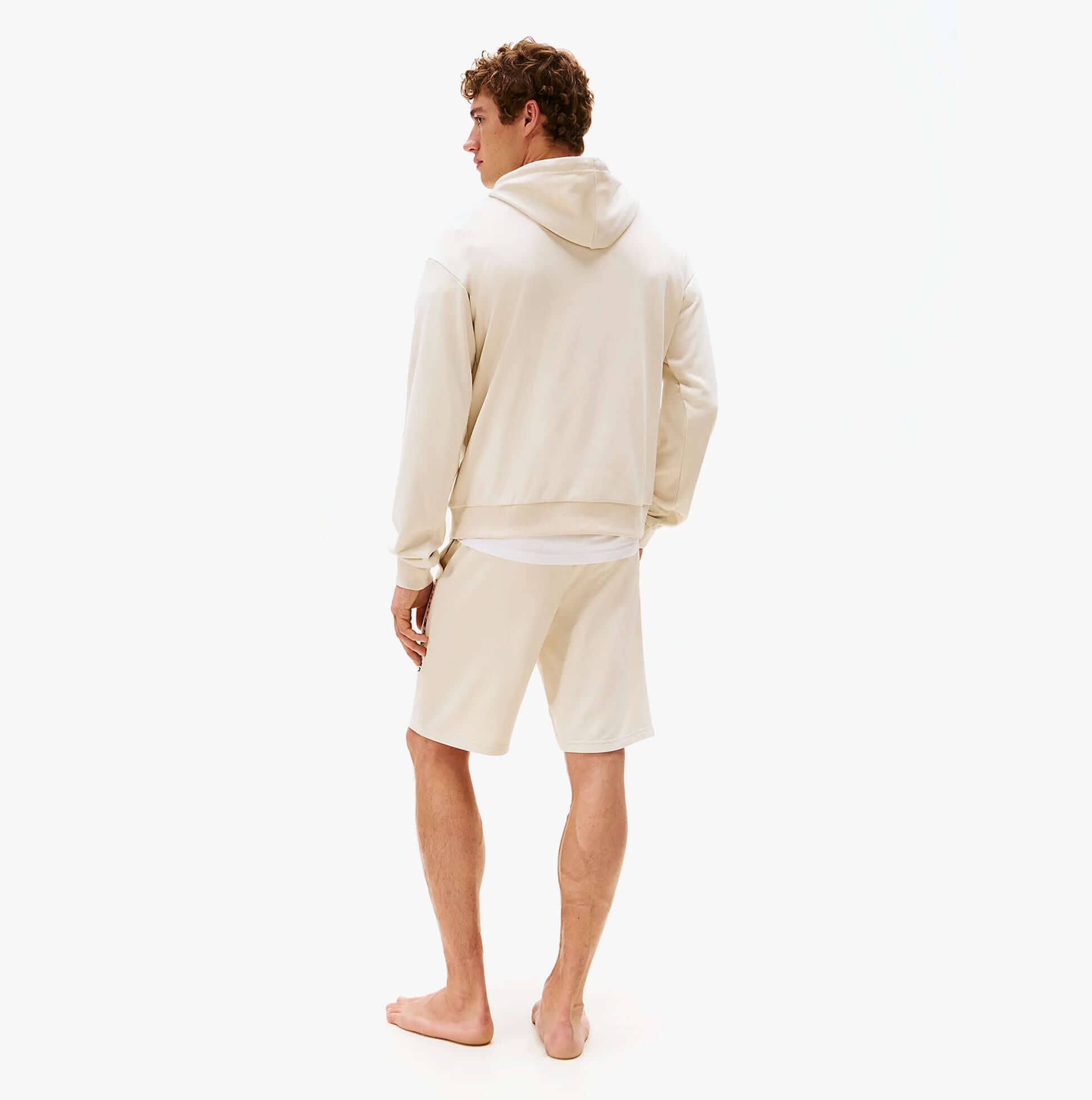 Tommy Hilfiger HOODIE Mens Drawstring Lounge Hoody Off White back view on model wearing shorts.