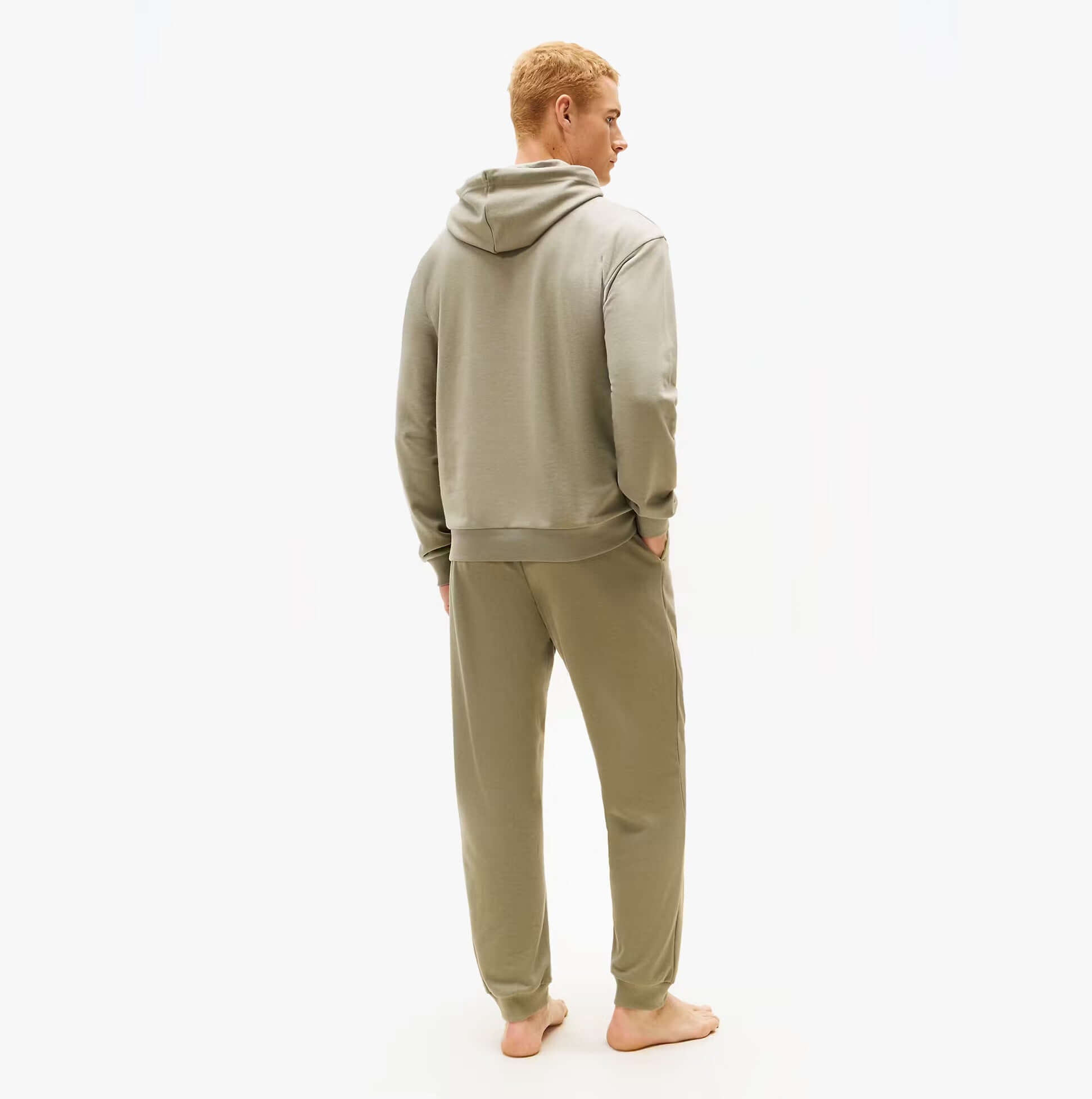 Tommy Hilfiger HOODIE Mens Drawstring Lounge Hoody Utility Sage back view on model, showing hoodie and pants in soft material.