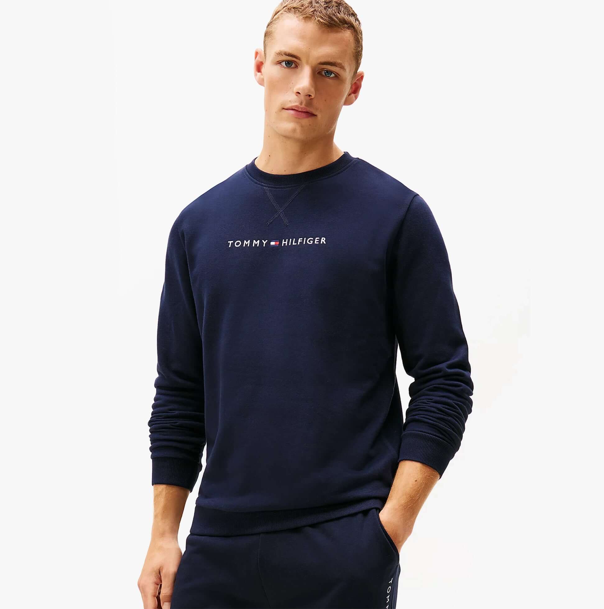 Tommy Hilfiger TRACK TOP Mens Sweatshirts Desert Sky front view model wearing navy sweatshirt.