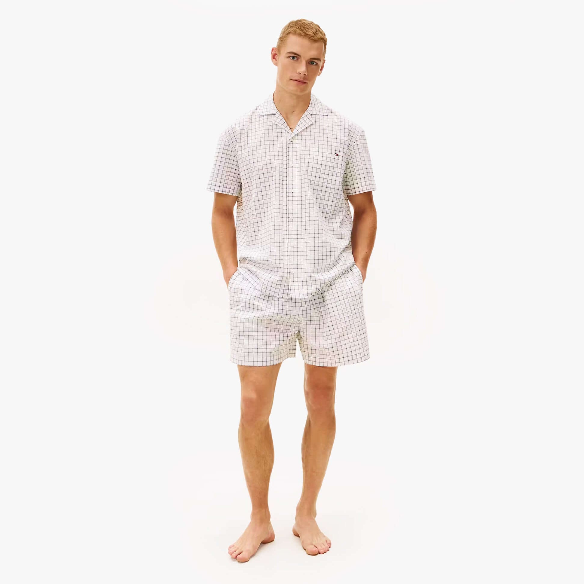 Tommy Hilfiger WOVEN PJ SET Mens Set Linear White Grid Check front view on model wearing short-sleeve shirt and shorts.