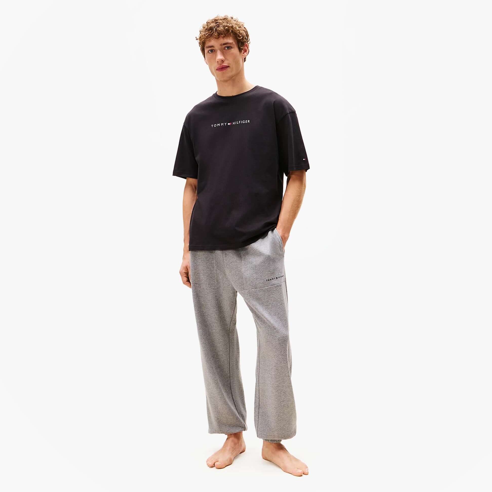 Tommy Hilfiger LOGO T-Shirt Mens Black front view worn with casual pants model
