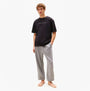 Tommy Hilfiger LOGO T-Shirt Mens Black front view worn with casual pants model