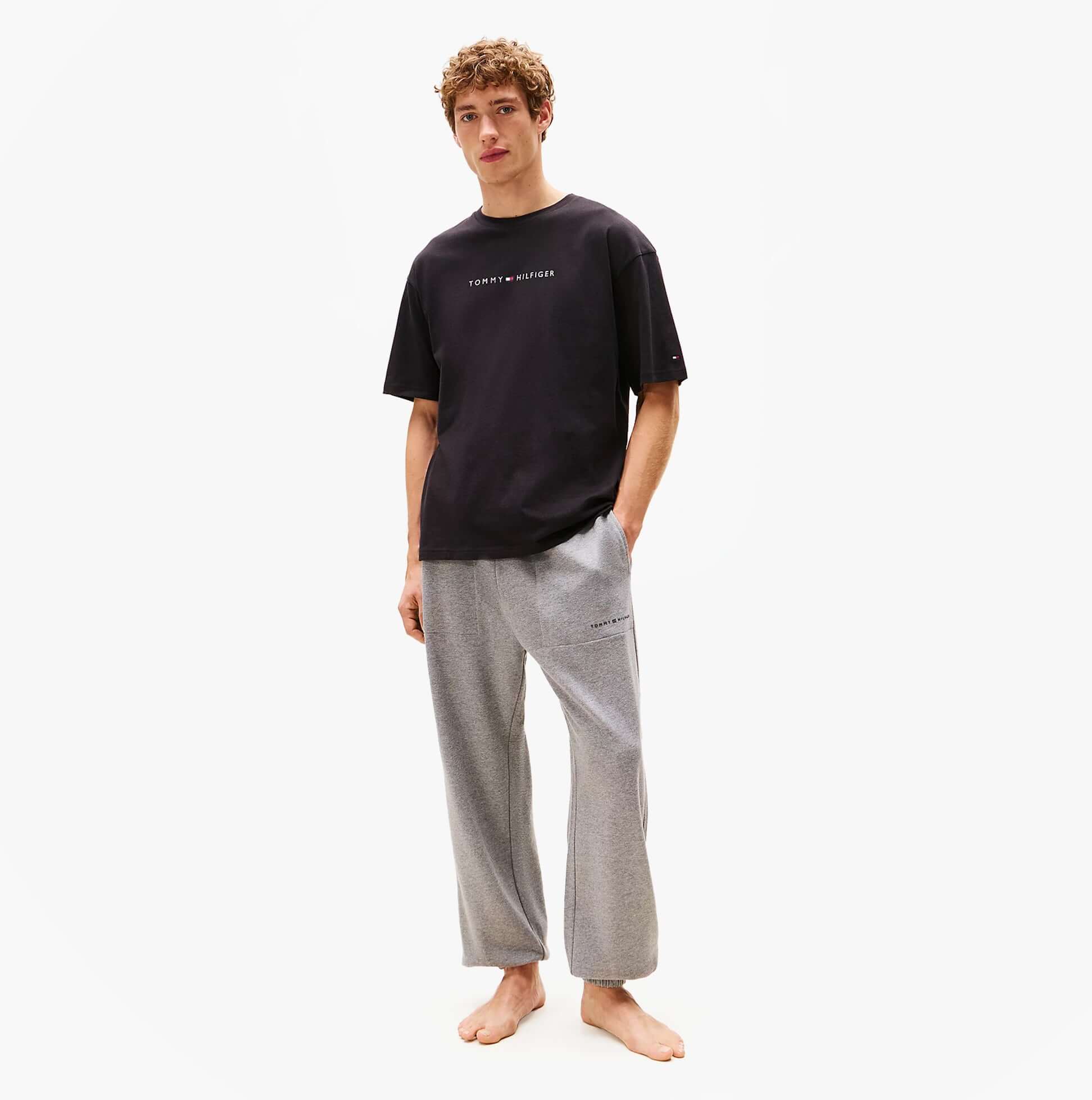 Tommy Hilfiger LOGO T-Shirt Mens Black front view worn with casual pants model