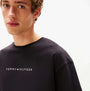 Tommy Hilfiger LOGO T-Shirt Mens Black detail view of logo on a black shirt model wearing it