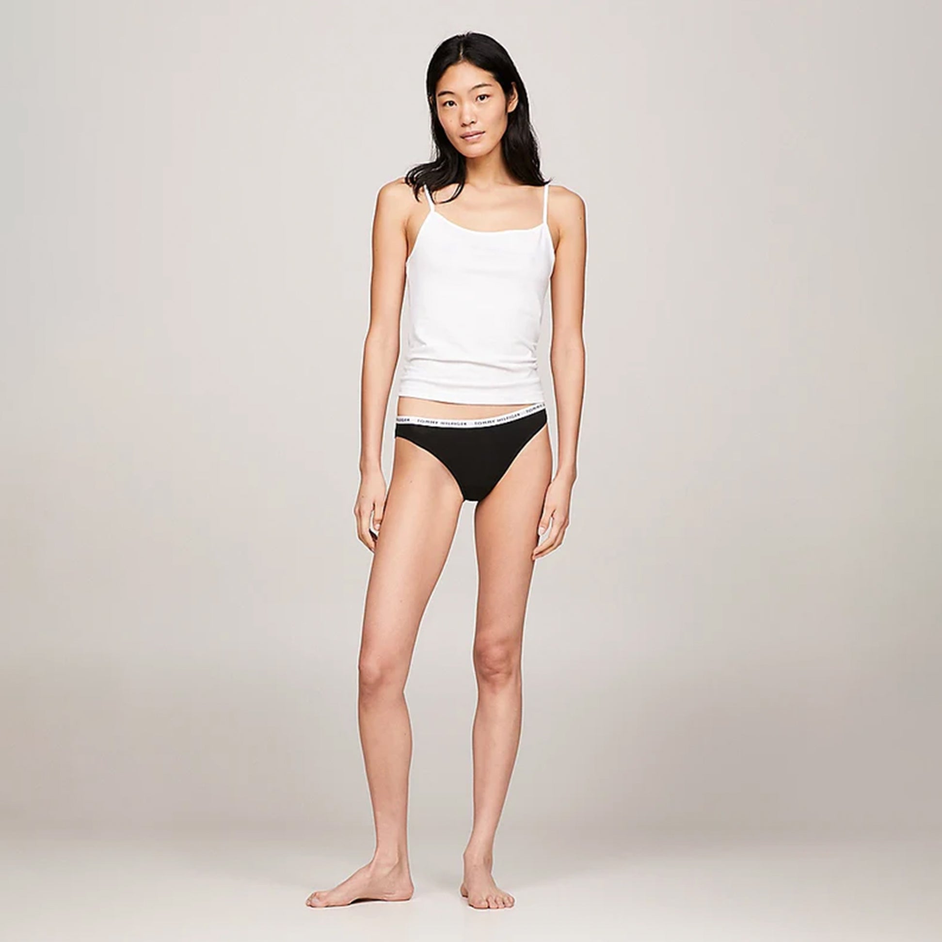 Tommy Hilfiger BIKINI 3 Pack Womens Briefs Black on model, front view, styled with white tank top and showcasing elastic waistband.