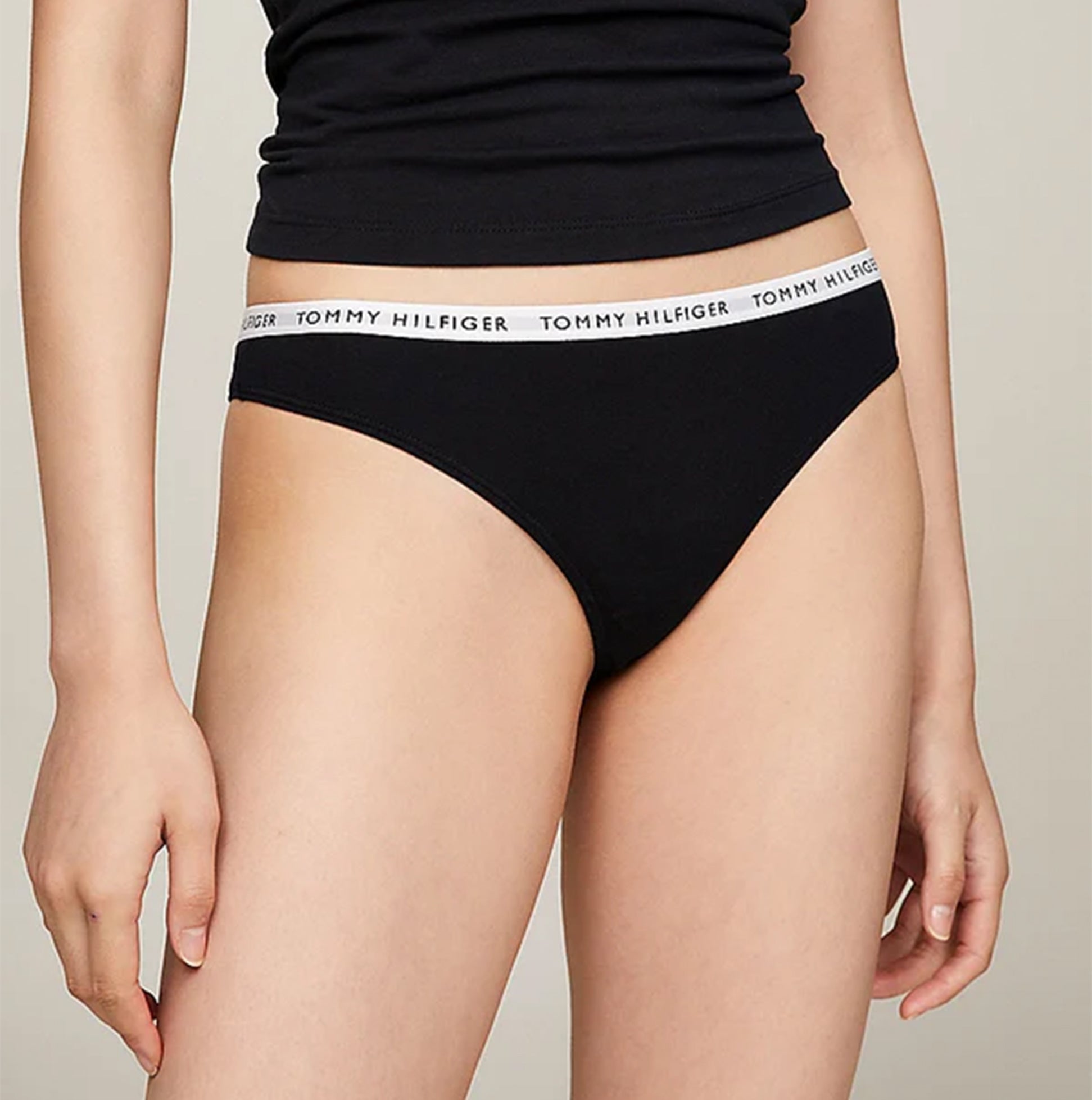 Tommy Hilfiger THONG 3 Pack Womens White/Desert Sky/Primary Red front view of black thong with logo waistband.