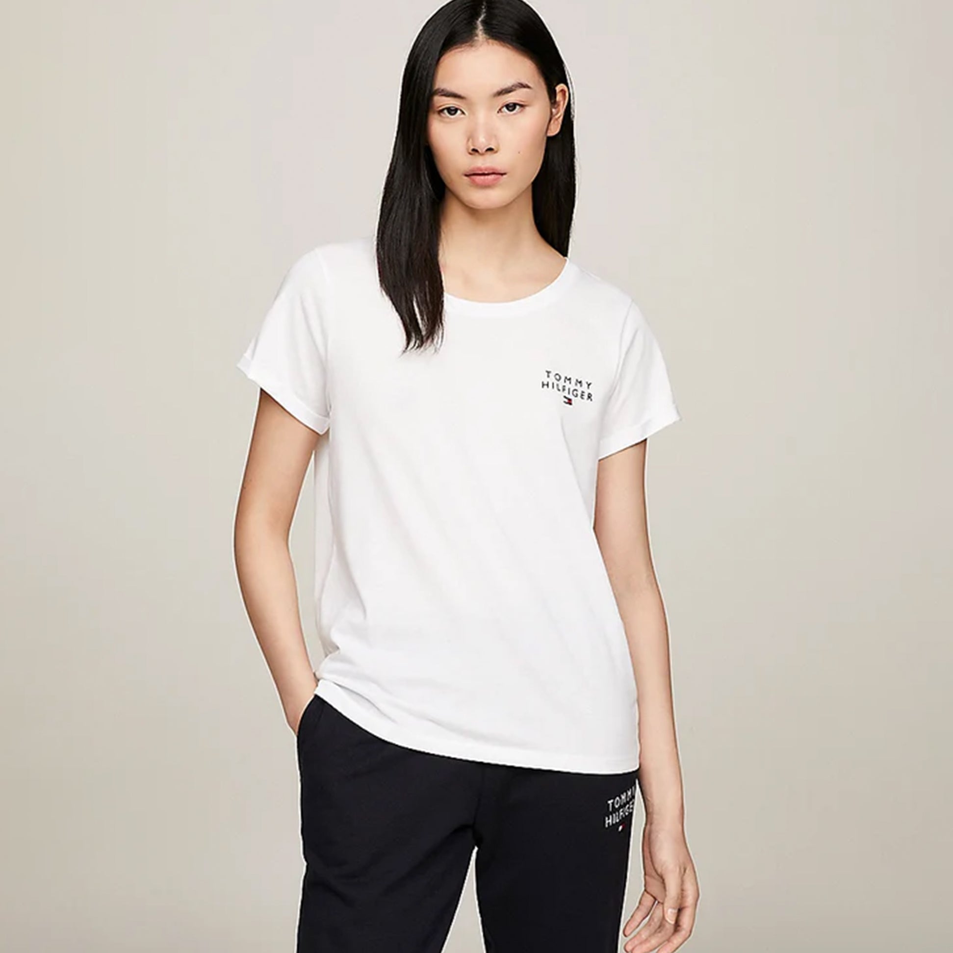 Tommy Hilfiger PURE COTTON Womens T-Shirt White front view model wearing crew neck t-shirt with TH logo.