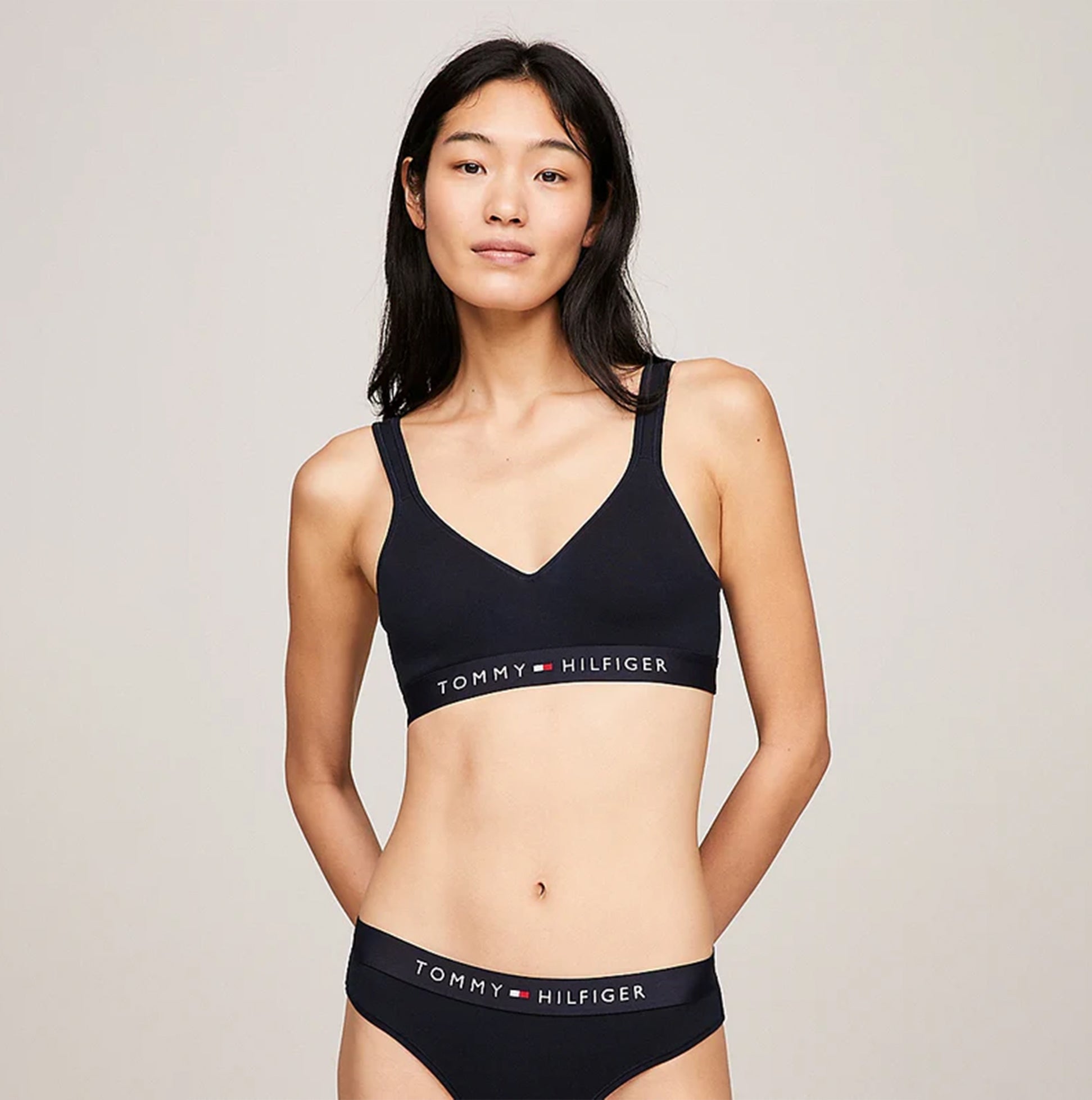 Tommy Hilfiger BRALETTE LIFT Womens Desert Sky front view model wearing bralette with logo detail.