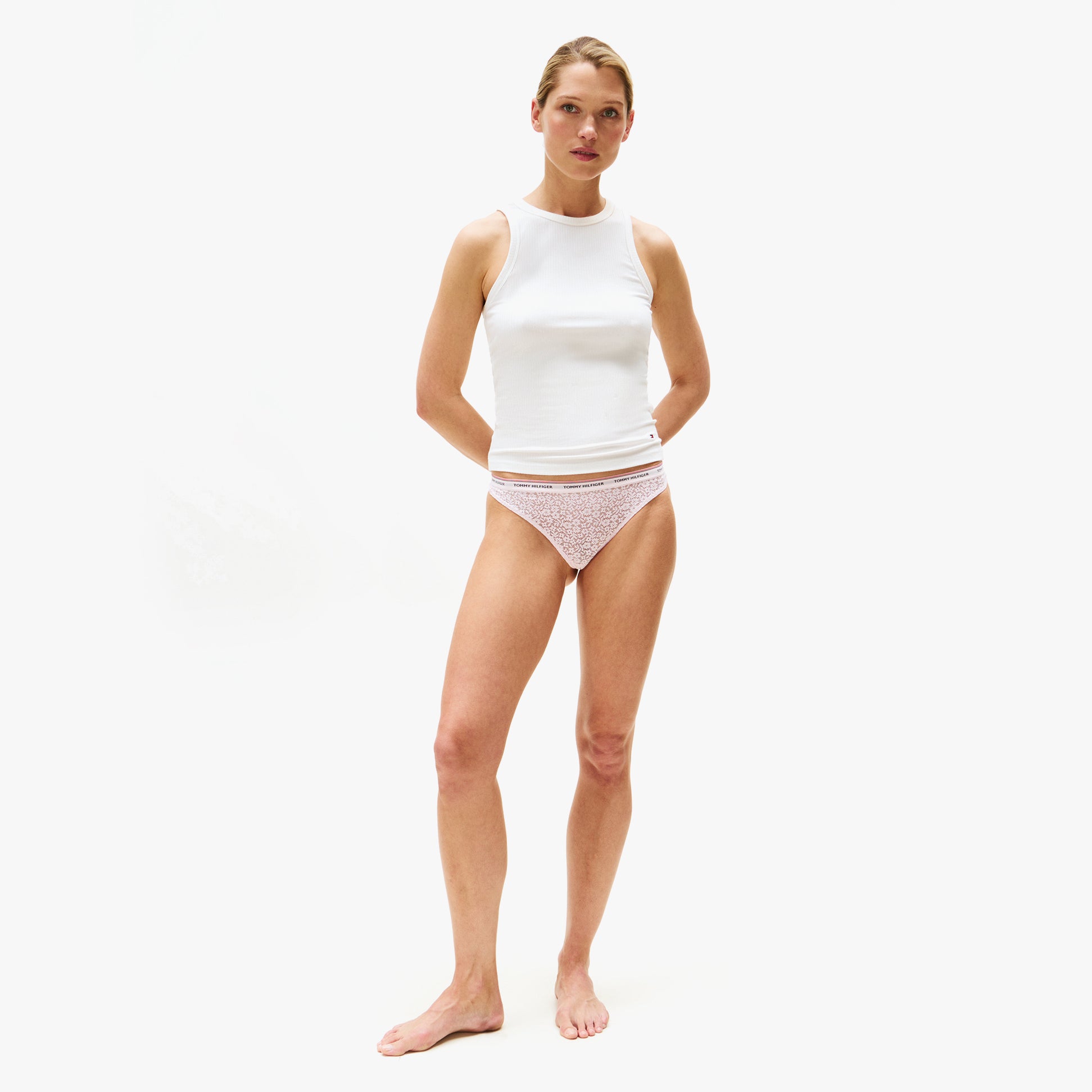 Tommy Hilfiger Womens 3 Pack Thong Lace Multicoloured front view on model wearing white tank top.