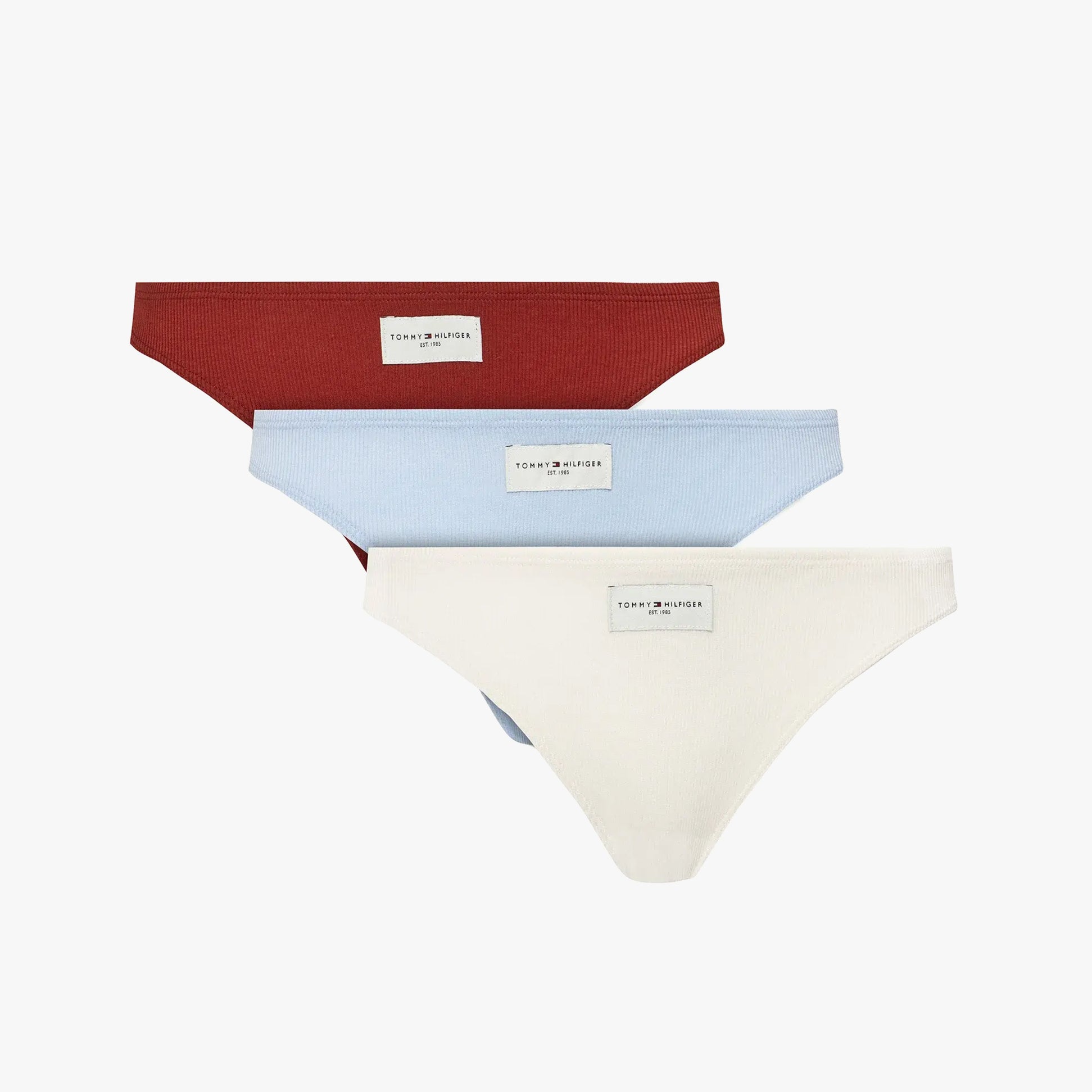 Tommy Hilfiger ESTABLISHED Womens 3 Pack Ribbed Thongs Multicoloured showing red, blue, and white thongs in front view.