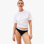 Tommy Hilfiger Womens 3 PACK THONG Multi front view of model wearing white crop top and black thong.