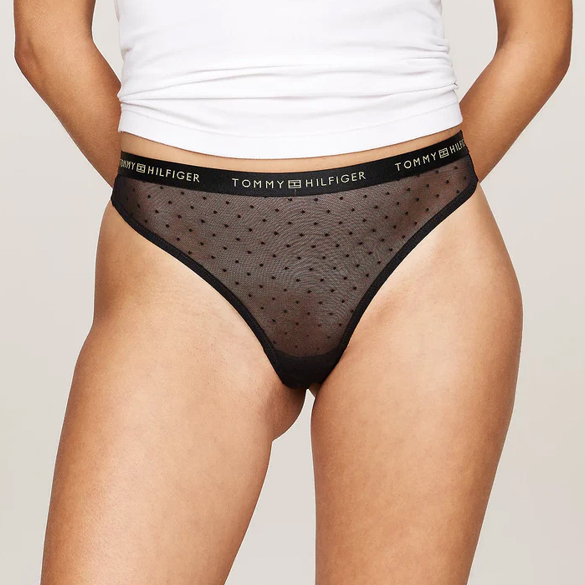 Tommy Hilfiger GIFT UNDERWEAR Womens 3 Pack Thongs Multicoloured side view showing black thong with dotted design.