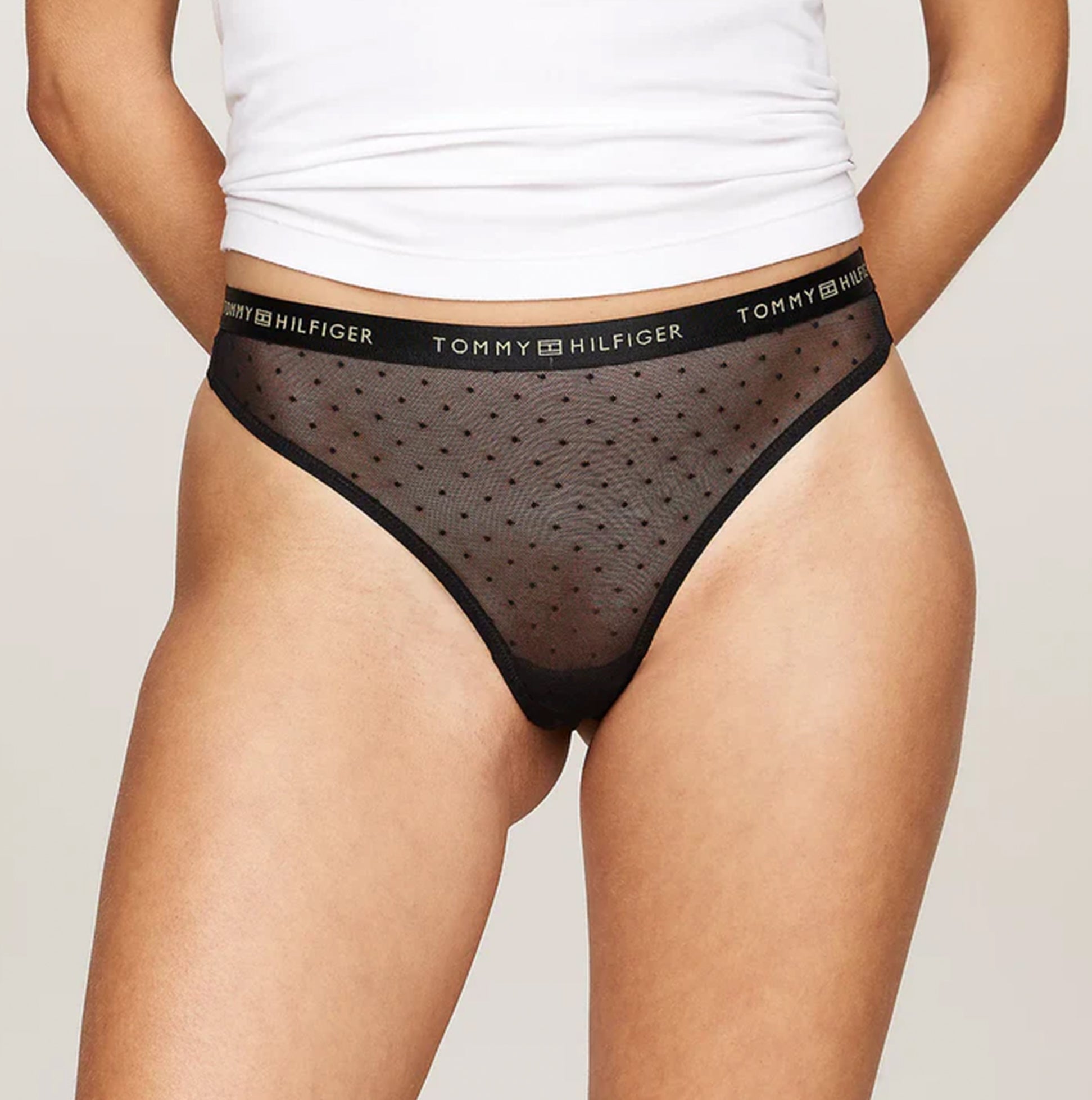 Tommy Hilfiger GIFT UNDERWEAR Womens 3 Pack Thongs Multicoloured side view showing black thong with dotted design.