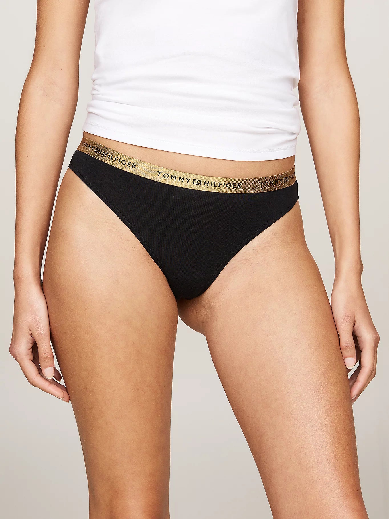 Tommy Hilfiger GIFT UNDERWEAR Womens 5 Pack Thongs Multicoloured front view of black thong with logo waistband.