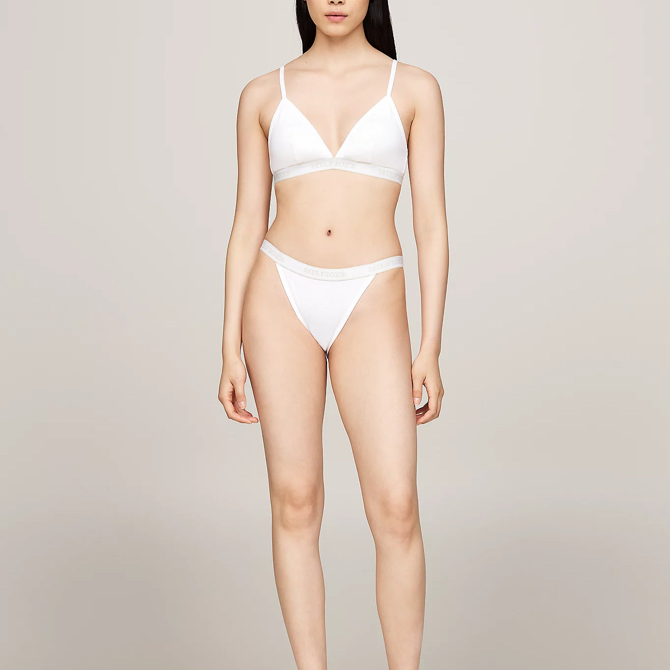 Tommy Hilfiger MONOTYPE Womens Tanga Bikini Briefs White front view worn by model, featuring high-cut leg and ribbed texture.