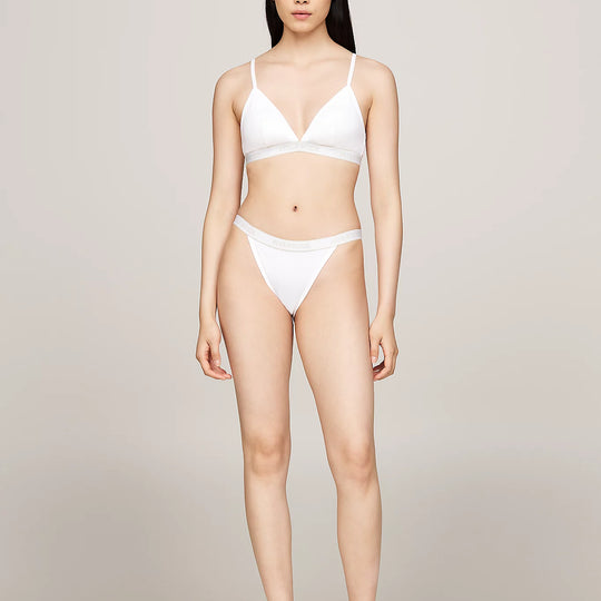 Tommy Hilfiger MONOTYPE Womens Tanga Bikini Briefs White front view worn by model, featuring high-cut leg and ribbed texture.