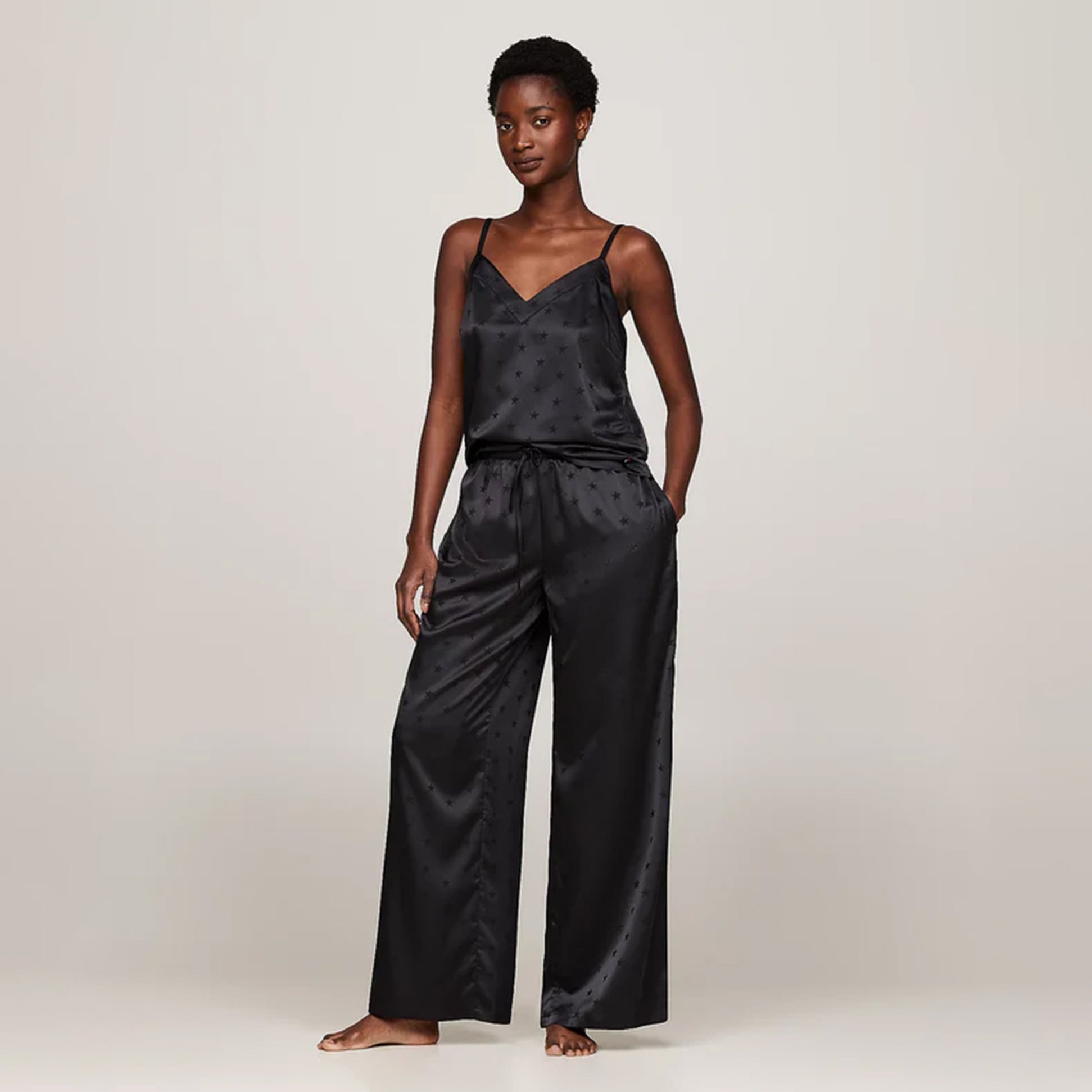 Tommy Hilfiger ESS HOLIDAY Womens Cami & Long Pants Black front view showcasing spaghetti strap design and loose-fitting pants.