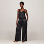 Tommy Hilfiger ESS HOLIDAY Womens Cami & Long Pants Black front view showcasing spaghetti strap design and loose-fitting pants.