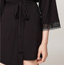 Tommy Hilfiger COMFORT Womens Modal Lace-Trim Kimono Robe Black detail view showing lace trim and tie detail of robe.