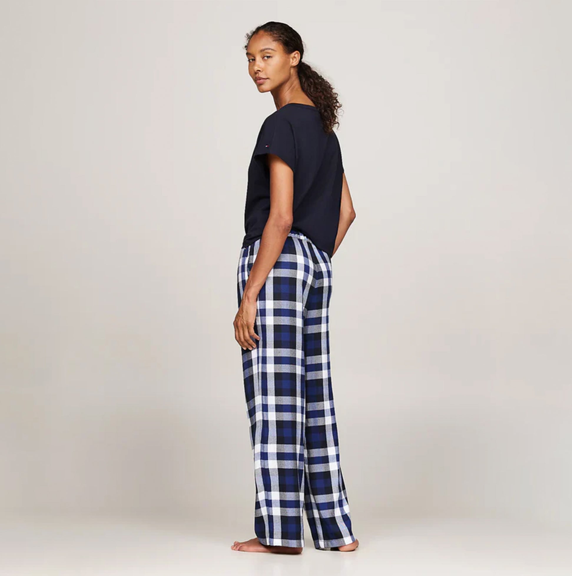 Tommy Hilfiger ORIGINAL Womens Flannel Pants Heritage Check Midi Blue Ink side view on model, showing plaid design and relaxed fit.