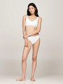Tommy Hilfiger MONOTYPE Womens Bralette Lifts White, front view on model, showcasing the sweetheart neck and ribbed texture.