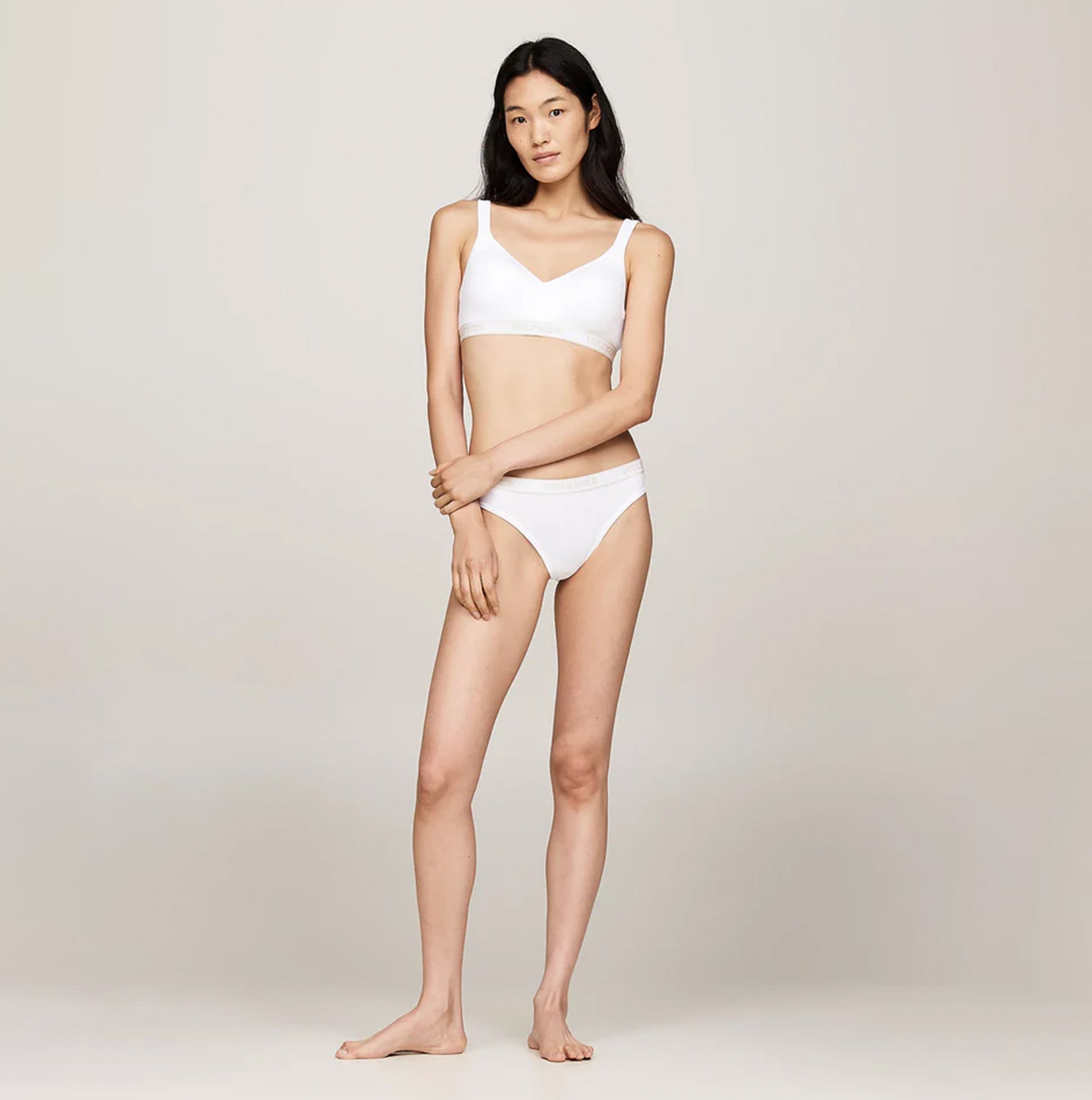 Tommy Hilfiger MONOTYPE Womens Bralette Lifts White front view worn by model showcasing sweetheart neck and ribbed texture.