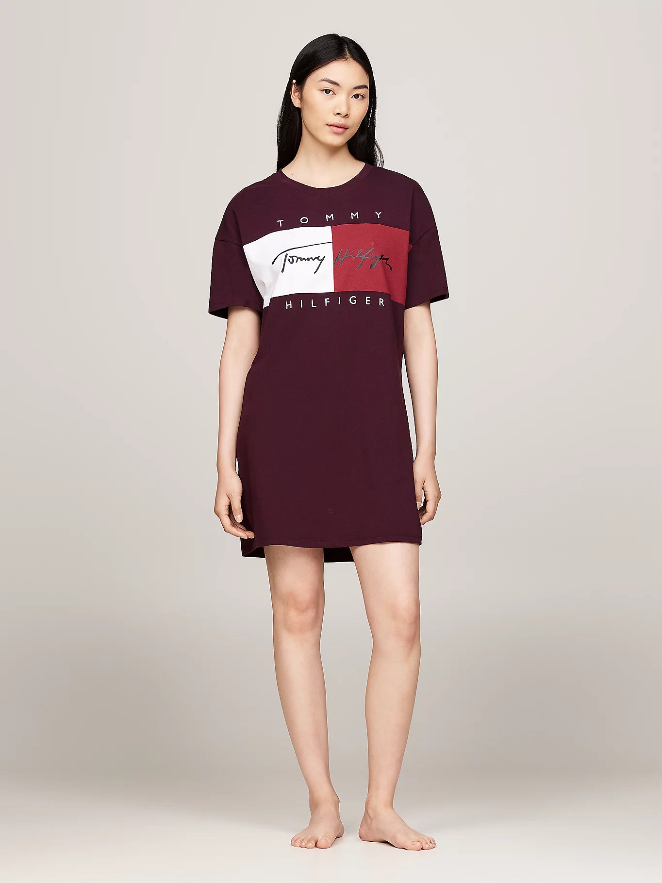 Tommy Hilfiger HERITAGE HOLIDAY Womens T-Shirt Dress Deep Burgundy front view worn by a model, showcasing relaxed fit and logo design.