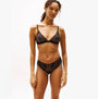 Tommy Hilfiger FLORAL LACE Womens Triangle Bra Black front view on model, showcasing lace details and adjustable straps.