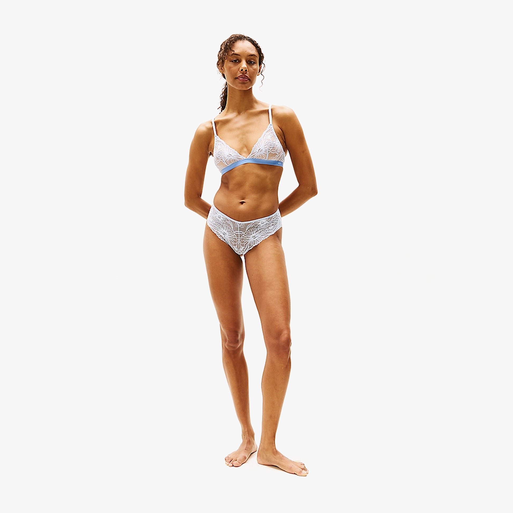 Tommy Hilfiger FLORAL LACE Womens Brazilian Briefs Sweet Blue front view, model wearing matching underwear set with lace detail.