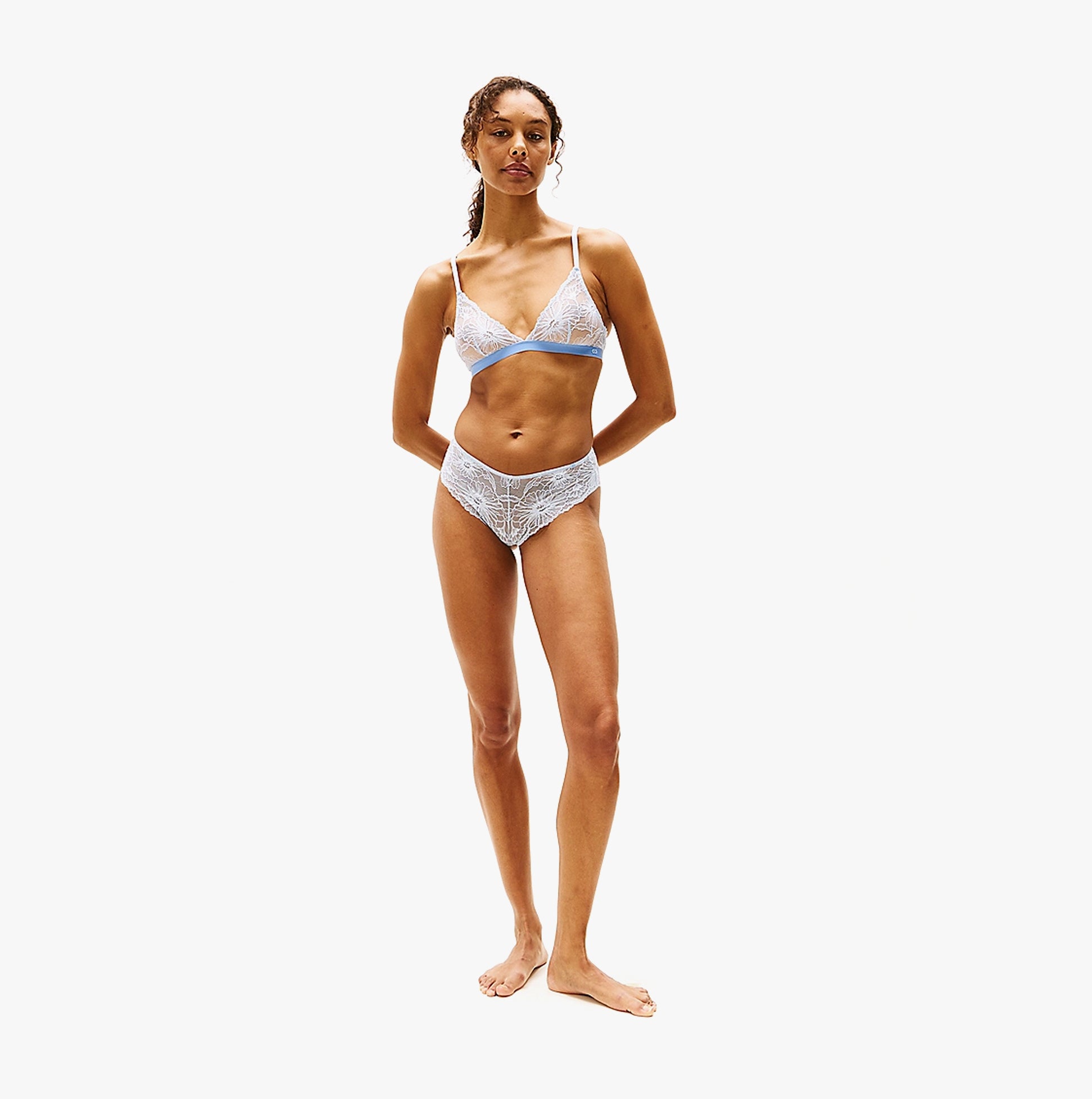 Tommy Hilfiger FLORAL LACE Womens Brazilian Briefs Sweet Blue front view, model wearing matching underwear set with lace detail.