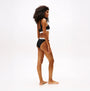 Tommy Hilfiger HERITAGE LOGO Womens Underband Non-Wired Bralette Black side view on model showing underband design.